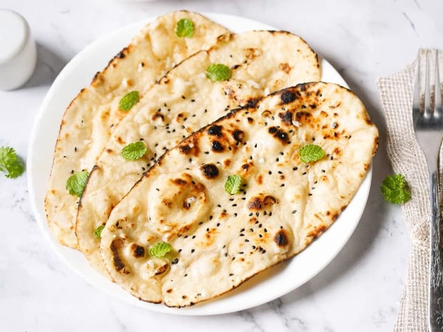 68.0 Garlic Naan.